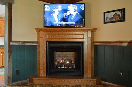The center of the farmhouse has a beautiful fireplace to warm up and relax our guests.