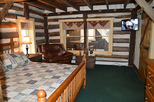 The logs of this cabin style room reminds you of the history of this old farmhouse.