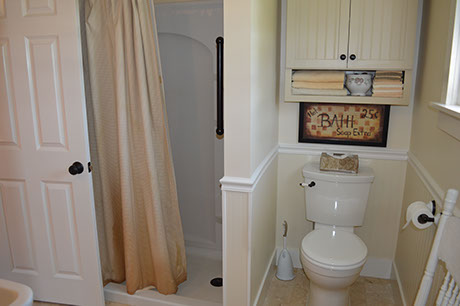 a walk-in shower is located on the first floor bathroom.